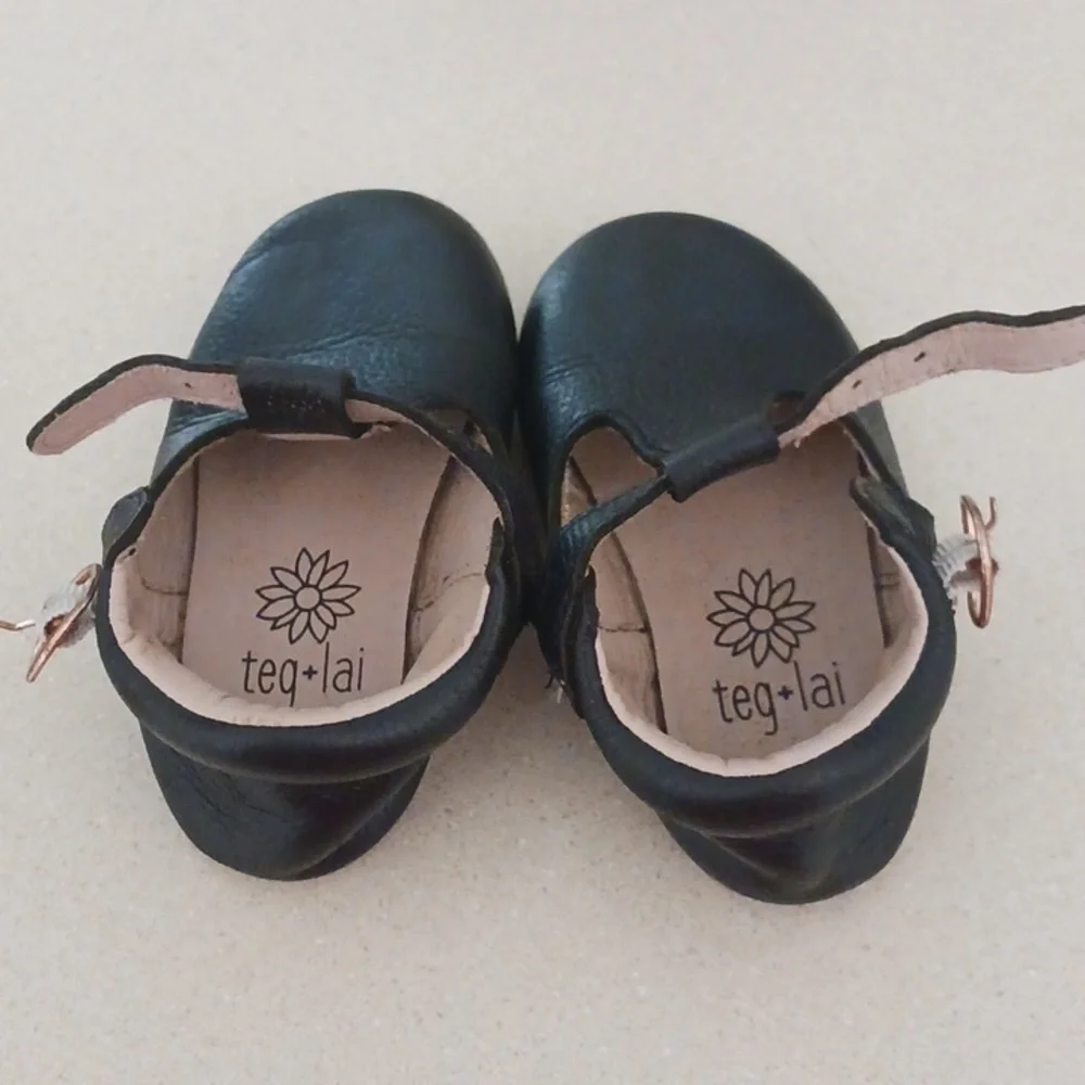 Teg+Lai  T Strap Black Rubber Flex Sole Shoes
